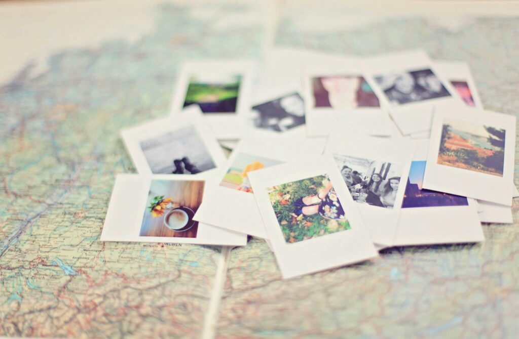 pexels-photo-185933-185933 A collection of Polaroid memories spread across a map, symbolizing travel adventures.